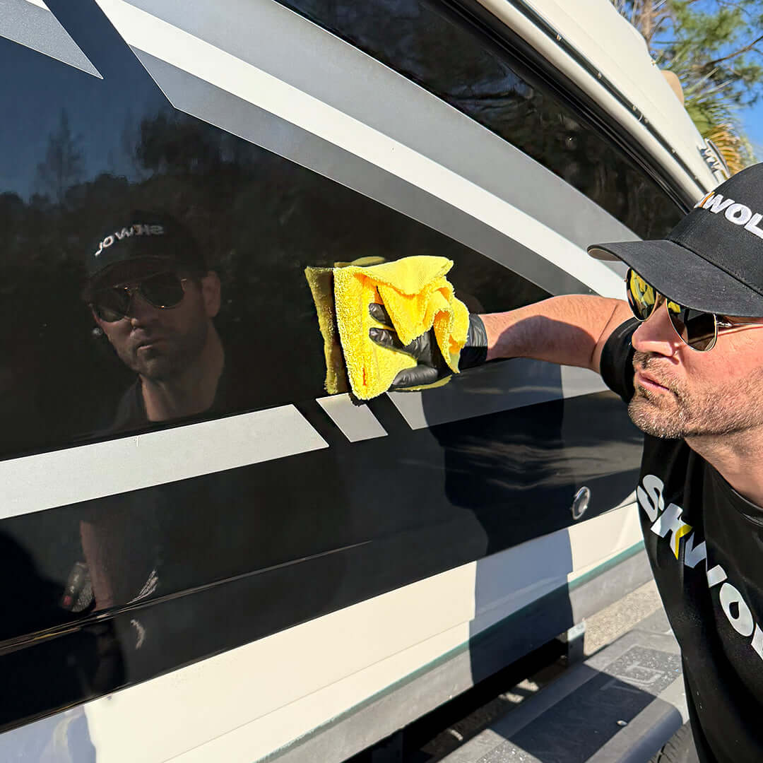 Coating a boat with SKWOL™ Ceramic Boat Top Coat to enhance shine, block UV rays, and deliver superior water repellency.